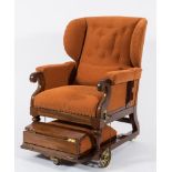 A 19th Century mahogany and upholstered patent adjustable wing armchair:, in brown moquette fabric,