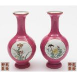 A pair of Chinese pink ground medallion vases: of baluster form with slender necks,