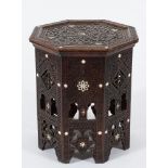 A Near Eastern carved wood and mother of pearl inlaid octagonal table:,