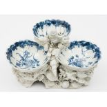 A Bow pickle dish: modelled with three shell shaped trays printed in blue with flowers within a