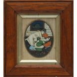 A Persian oval erotic miniature: of lovers in an interior setting, framed and glazed,