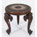 An Indian carved hardwood circular occasional table:,