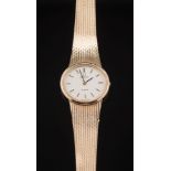 A lady's 9ct gold quartz 'Omega' wristwatch: the oval dial with baton markers and on 9ct gold,