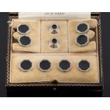 A suite of early 20th century 18ct white gold, black onyx and diamond cuff-links,