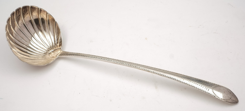 A George III Irish silver bright-cut pointed Old English pattern soup ladle, maker John Sheils,