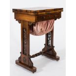 A Victorian rosewood games and work table:, with a rectangular velvet lined hinged top,
