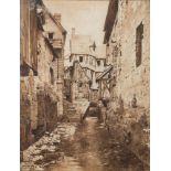 G Nicholson [19/20th Century]- Stone cottages and a stream in a town:- signed and dated