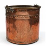 A 19th century copper log bin: of cylindrical form, with brass loop carrying handle, 50cm. high.