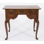 A mid 18th Century oak rectangular lowboy:, the top with rounded corners,