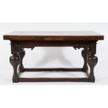 A 17th Century Dutch oak draw leaf dining table:, with a rectangular top on bulbous turned legs,