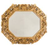 A 19th Century carved giltwood Florentine octagonal wall mirror:, the plate within an acanthus,