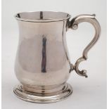 A George III silver mug, maker Fuller White, London, 1761: of plain baluster form,