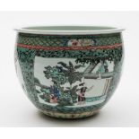 A Chinese porcelain jardiniere: of circular form enamelled in the famille verte palette with
