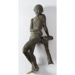 An abstract bronze figure of a young boy: leaning against a tree stump, unsigned and undated, 64cm.