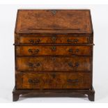 An early 18th Century (and later) burr walnut veneer and cross and feather banded bureau:,