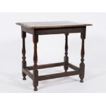 An 18th Century oak rectangular side table:, the top with a moulded edge, on turned baluster legs,