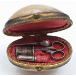 A late 19th Century miniature mother of pearl etui: the domed lid enclosing miniature sewing