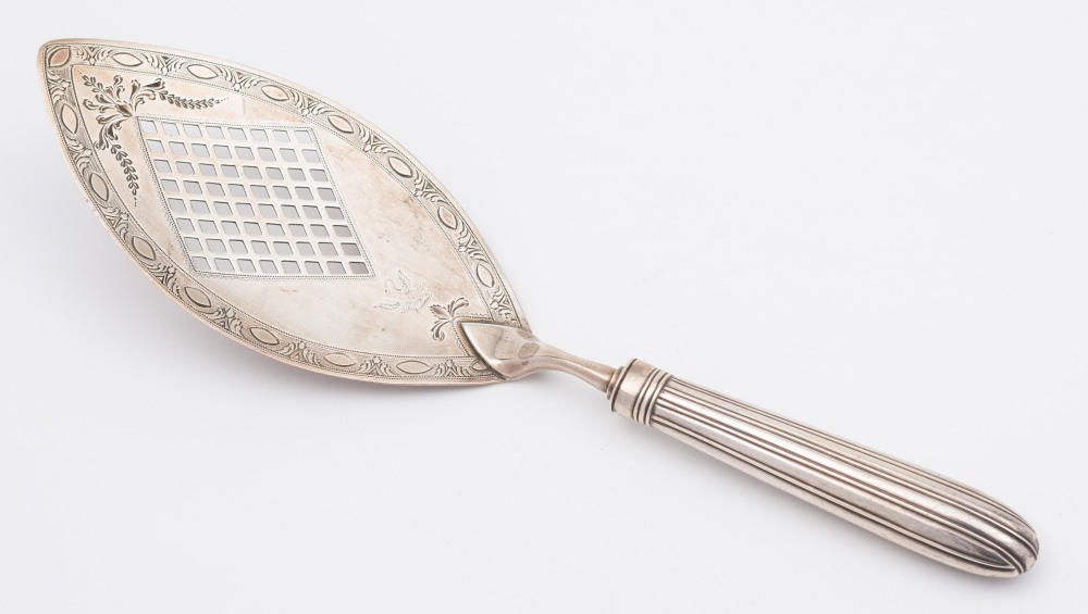 A George III silver fish slice, maker Robert Hennell I, London, 1790: crested,