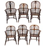 Six early 19th Century stick back Windsor elbow chairs:, five being in yew wood, elm and beech,