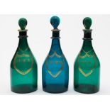 Three Bristol green glass decanters: of typical mallet shaped form with ribbed neck and lozenge