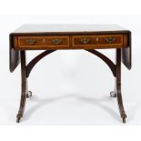 A 19th Century mahogany and satinwood crossbanded sofa table:, raised on trestle end supports.