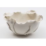 A Chinese blanc de Chine Dehua lotus bowl: in the form of a lotus flower with applied buds,