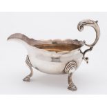 A George II silver sauce boat, maker's mark worn, London, 1752: with wavy edge border,