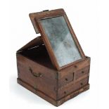 An walnut travelling box: of rectangular outline the hinged lid enclosing a folding mirror plate,