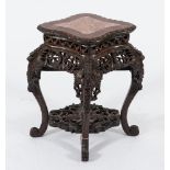 A Chinese carved hardwood jardiniere stand:, of navette shaped outline,
