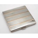 A George V silver and gold inlaid cigarette case, maker William Neale & Son Ltd, Birmingham,