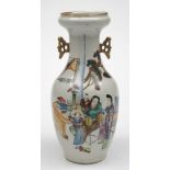 A Chinese porcelain vase: of baluster form with pierced handles and in-scrolling neck,