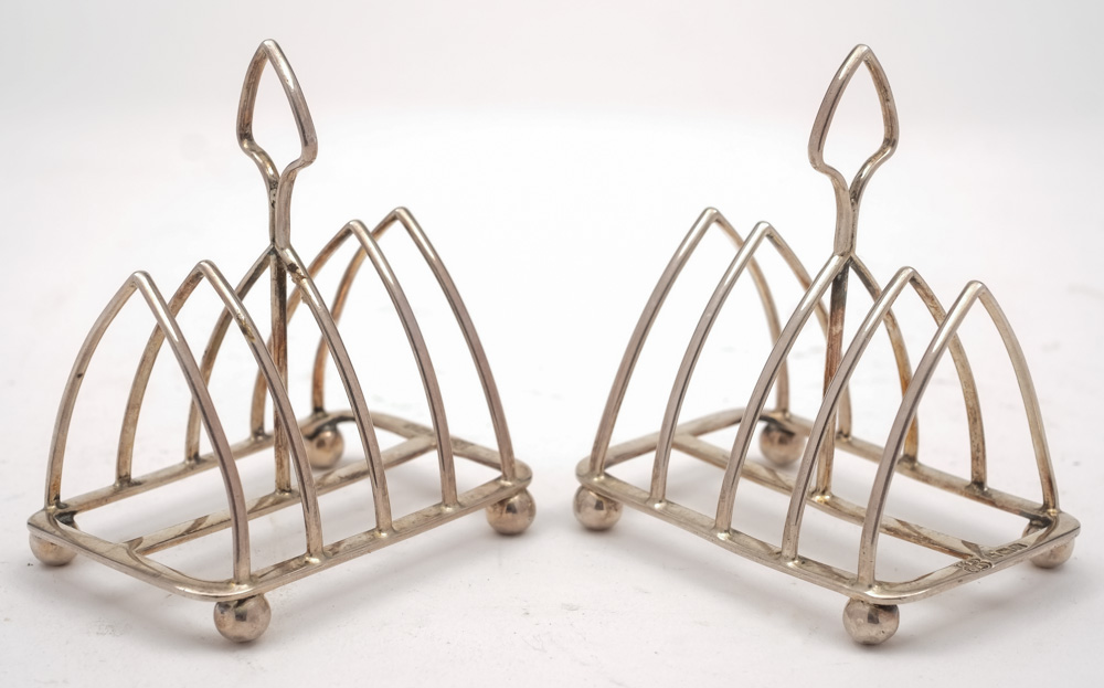 A pair of George V silver four-bar toast racks, maker David & George Edward, Sheffield,