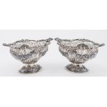 A pair of Edward VII silver oval pierced sweetmeat baskets, maker Goldsmiths & Silversmiths Co.