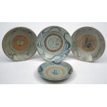 Four Chinese provincial bowls: each of shallow form painted in blue with calligraphic designs,