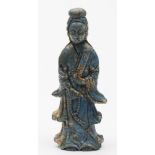 A Chinese carved lapis lazuli figure of Guanyin: wearing flowing robes and holding a scroll in one