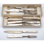 A set of eight George VI mother of pearl and silver fruit knives and forks,maker Roberts & Belk Ltd,