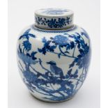A Chinese blue and white ginger jar and cover: painted with birds amongst tree peonies,