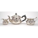 An Edward VII batchelor's silver three-piece tea service, maker's marks worn, Birmingham,