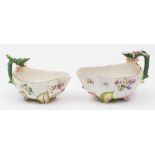 Two Chelsea strawberry leaf sauceboats: each with rustic stalk handle applied with strawberries and