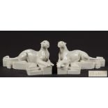 P Trudeau, a pair of faux marble models of recumbent panthers: in the Art Deco taste,