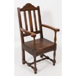 An 18th Century oak and fruitwood lambing armchair:,