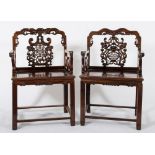 Two similar Chinese carved Hua Li wood armchairs:,