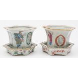A pair of Chinese famille rose hexagonal small jardinieres with matched stands: painted with