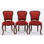 A set of six Victorian mahogany dining chairs:, in the French taste with upholstered cartouche,