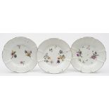 A set of three Meissen plates: each moulded in Gotzkowsky manner with flowers and foliage and