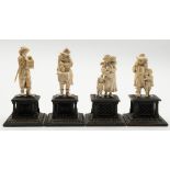 A group of four German carved ivory figures: one pair depicting a mother with her three children