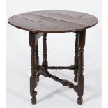 An 18th Century oak circular single drop flap gateleg or credence table:,