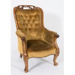 A Victorian carved rosewood armchair:,