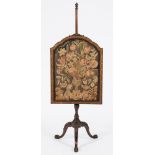 A carved walnut polescreen in the early 18th Century taste:,