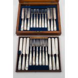 A set of twelve Victorian silver and mother of pearl handled dessert knives and forks,